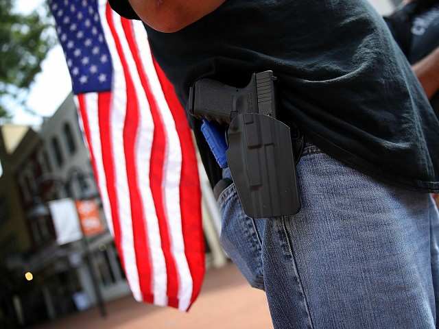 handgun and flag