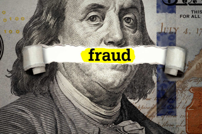 shutterstock_1901345269.jpg featured image Dollar bill with fraud text overlay