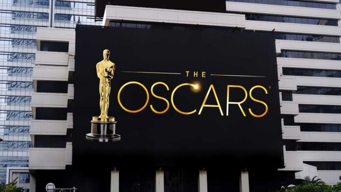 shutterstock_2251385311.jpg featured image Oscars billboard on a city building exterior wall