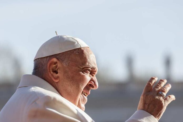 Pope Francis waving.
