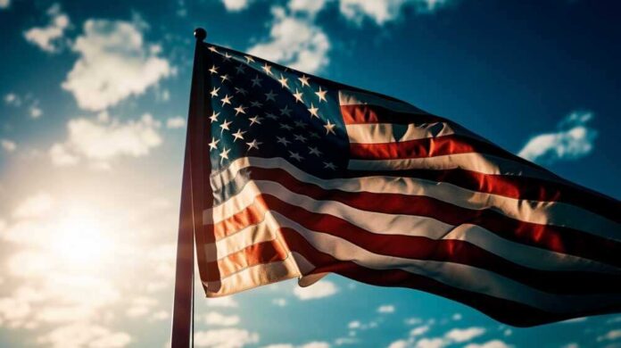 shutterstock_2298660407.jpg featured image American flag waving against a bright sky.