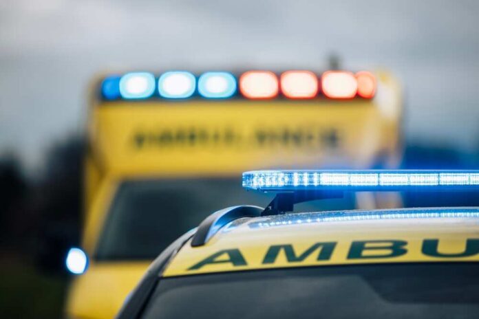 shutterstock_2447103545.jpg featured image Ambulances with flashing lights on emergency scene.