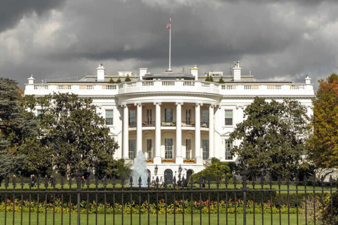 shutterstock_560339335.jpg featured image The White House with dark clouds overhead.
