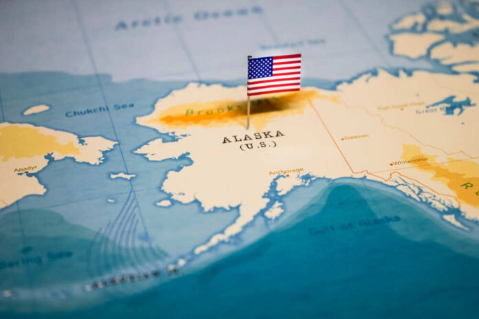 shutterstock_1326838760.jpg featured image Map of Alaska with a small American flag