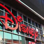 Venezuelan Workers at DISNEY Get Bad News! Disney sign on building with Mickey Mouse figure