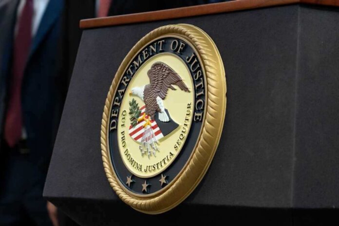 shutterstock_2290672573.jpg featured image Department of Justice seal on a podium.