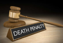 Gavel beside death penalty sign on desk
