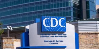 CDC building sign in front of structure.