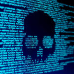 Cyberattack Strikes MSM News Outlet! Skull silhouette in blue computer code background.