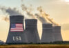 Cooling towers with USA flag and smoke clouds