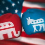 Democrat LEAVES Party – Switches Up! Red Republican glove and blue Democrat glove facing off.