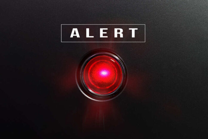 shutterstock_582441490.jpg featured image Red alert light on black background