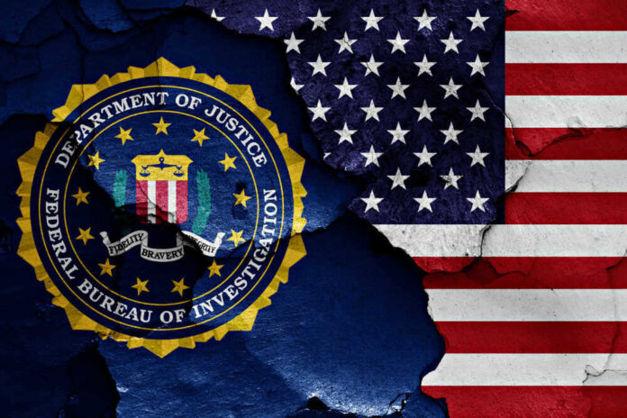 shutterstock_1023380488-1.jpg featured image FBI seal overlaid on the American flag background.
