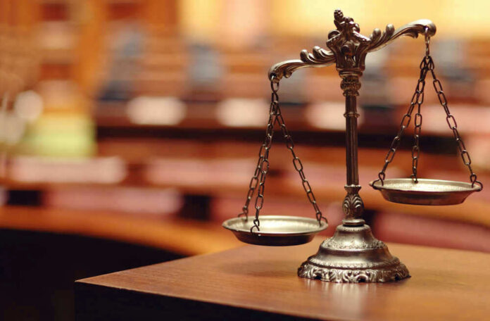 shutterstock_140867215.jpg Scales of Justice