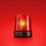 Red emergency light on solid red background.