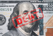 Hundred dollar bill with red debt stamp