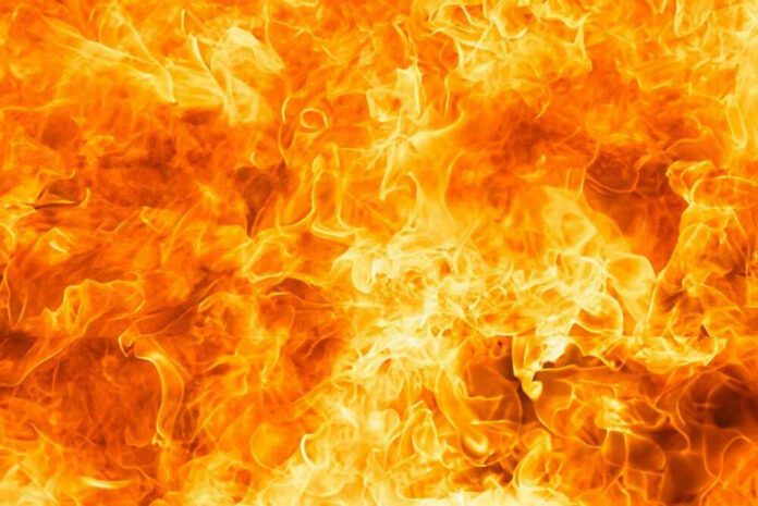 shutterstock_2477449591.jpg Bright orange and yellow flames burning intensely