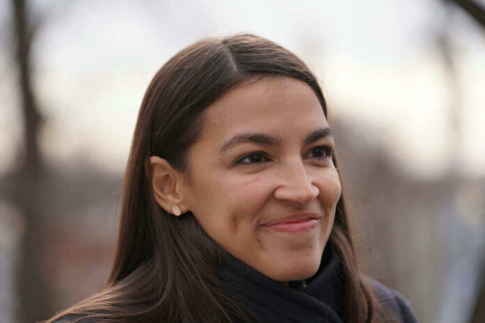 Alexandria Ocasio-Cortez or AOC smiling