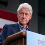 Bill Clinton speaking at podium