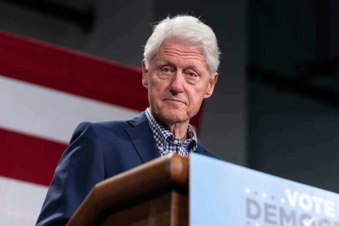 Bill Clinton speaking at podium