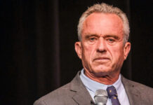 Robert F Kennedy Jr holding microphone