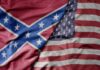 A close-up of the American flag and the Confederate flag overlapping