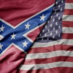 A close-up of the American flag and the Confederate flag overlapping