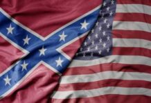 A close-up of the American flag and the Confederate flag overlapping