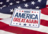 Sign saying Make America Great Again on American flag