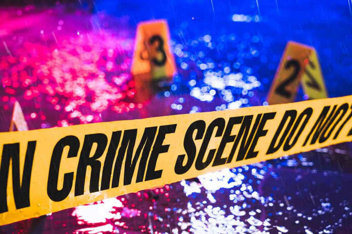 Crime scene tape with blurred evidence markers