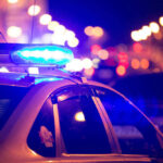 VIDEO: Bodycam Catches Police Heroics — They Saved Her! Police car with flashing blue lights at night