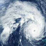 Typhoon DESTROYS American Towns — Residents Trapped Satellite image of a hurricane over the ocean.