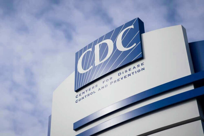 CDC building sign against a cloudy sky