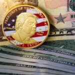 Commemorative coin featuring Donald Trump on a background of US dollar bills