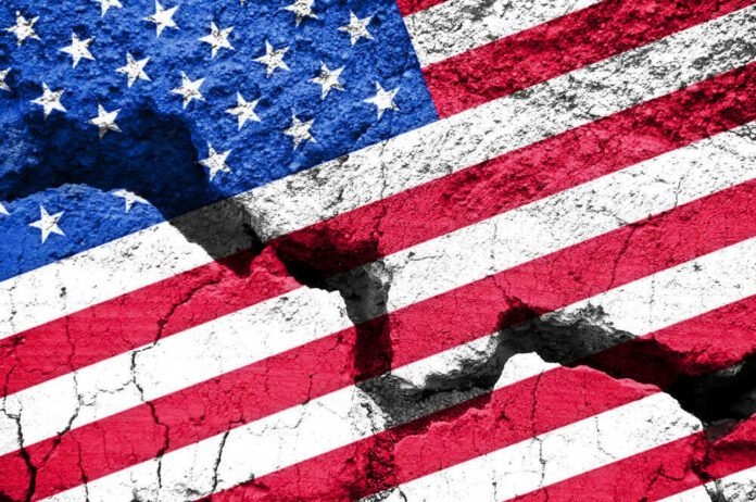 Cracked United States flag on textured surface