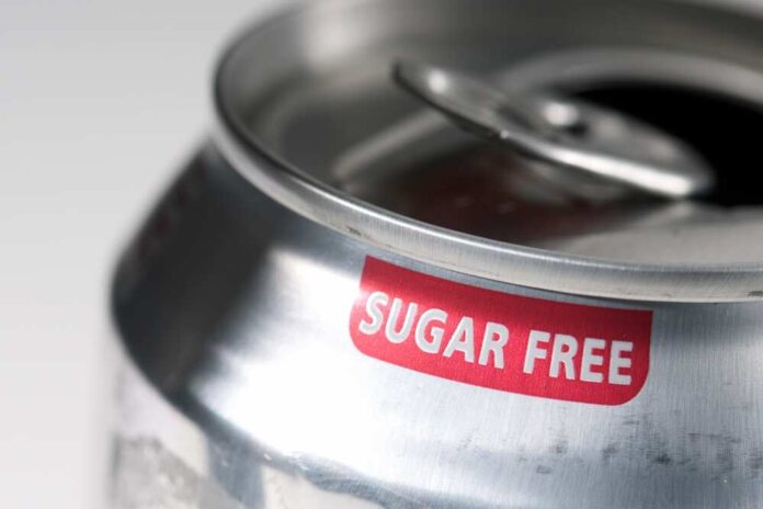 Close-up of a soda can with a 'sugar free' label
