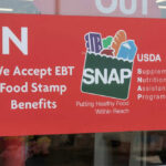 SNAP Overhaul Stuns Millions Red sign accepting EBT food stamp benefits SNAP