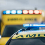 Senator’s Face SLAMS Ground — Emergency Response Ambulances with flashing lights on emergency scene.