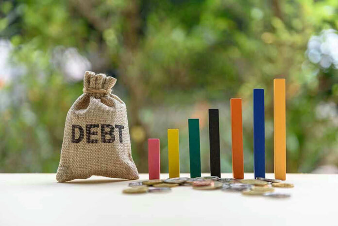 Debt sack with rising financial graph bars.