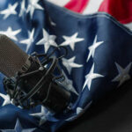 Huge Loss Rocks American Music Microphone placed on an American flag