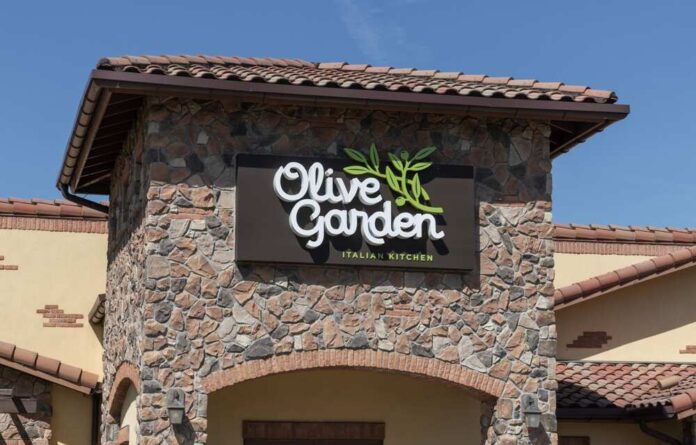 Olive Garden restaurant sign on a stone building