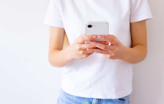 Person holding a smartphone in their hands