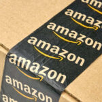 Amazon Recall: 200K Units at Risk Close-up of an Amazon-branded shipping box tape on a cardboard box