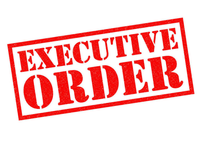Red stamp reading executive order