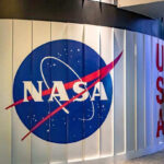 Urgent NASA Medical Evac From Space NASA sign with USA in the background.