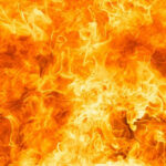 Horrific Blaze Kills 40 — Safety Inspections Ignored! Bright orange and yellow flames burning intensely.