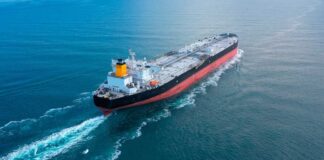 An oil tanker navigating through calm ocean waters