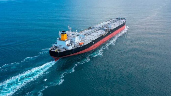 An oil tanker navigating through calm ocean waters