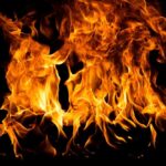Bright flames dancing against a dark background