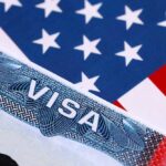Trump’s New Visa Freeze Shakes 75 Nations Close-up of a US visa on a background of the American flag